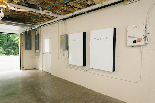 Tesla Powerwalls installed in a residential setting.